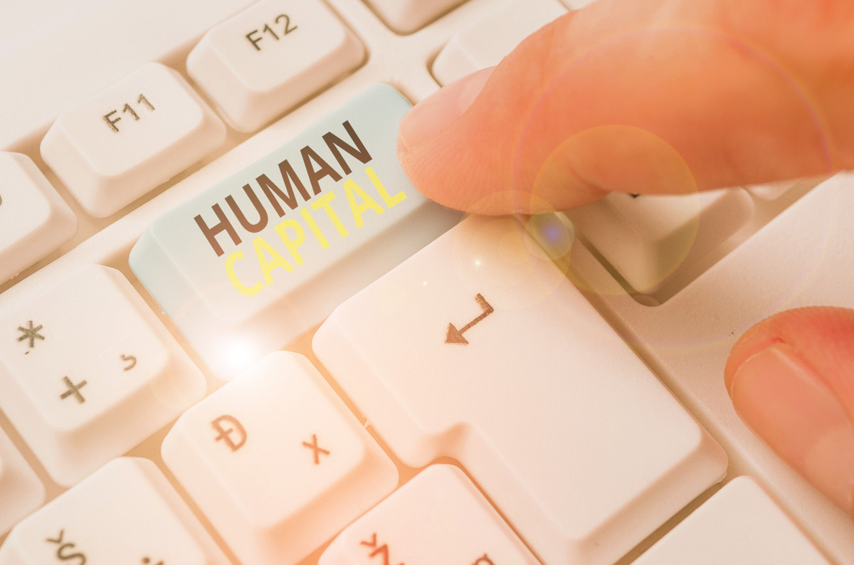 Laptop keyboard with button named Human Capital