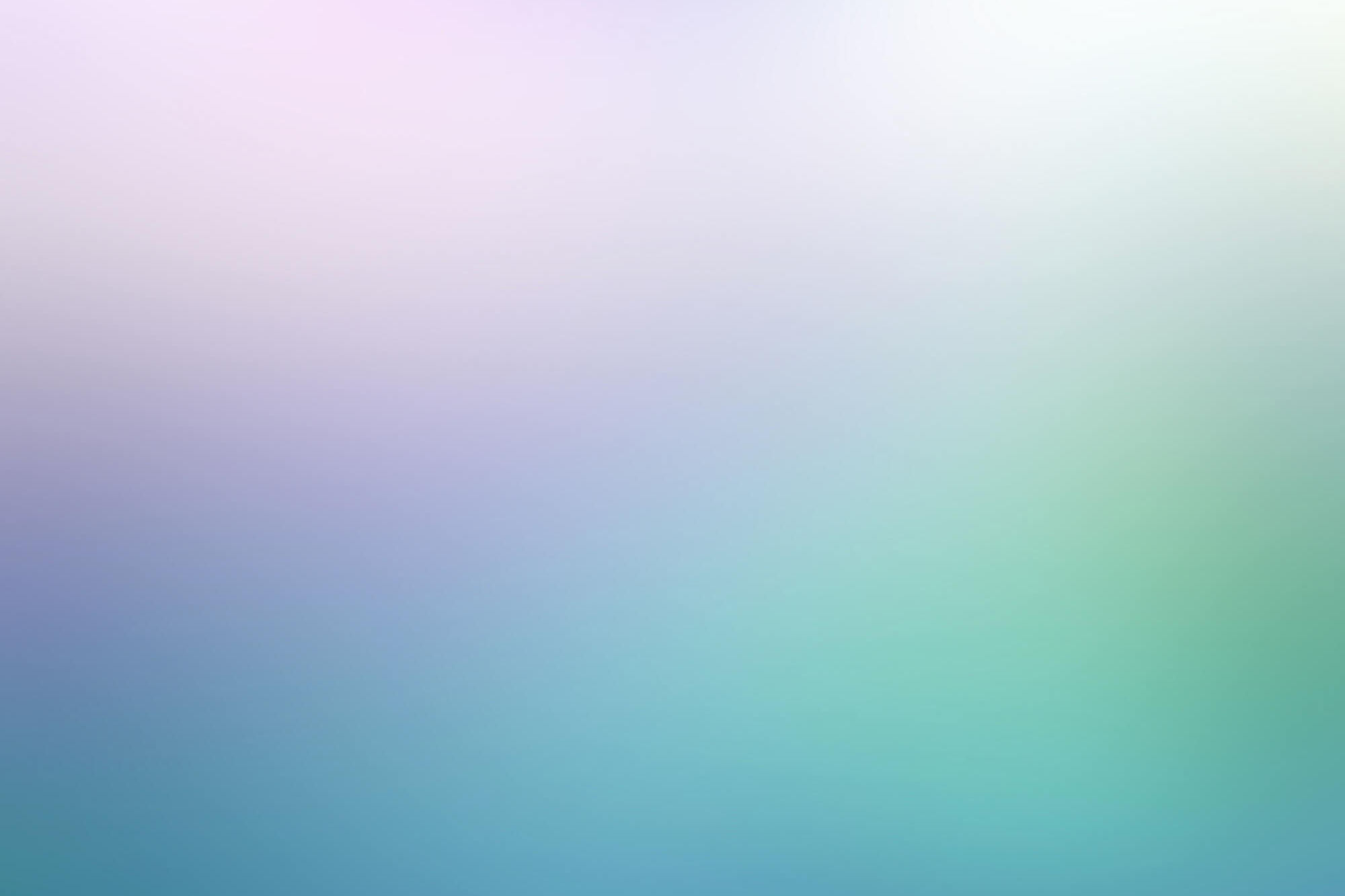 Abstract gradient of purple, green, and blue colors